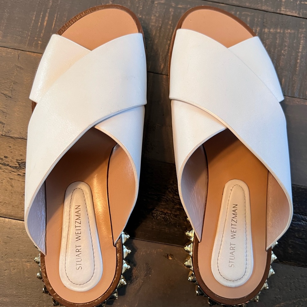 Authentic Stuart Weitzman White Sandals with Gold Hardware details.